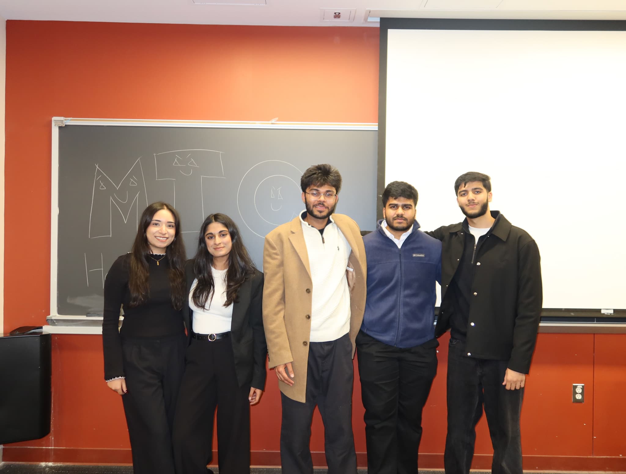 Group photo of the MTC organizing team after a successful event